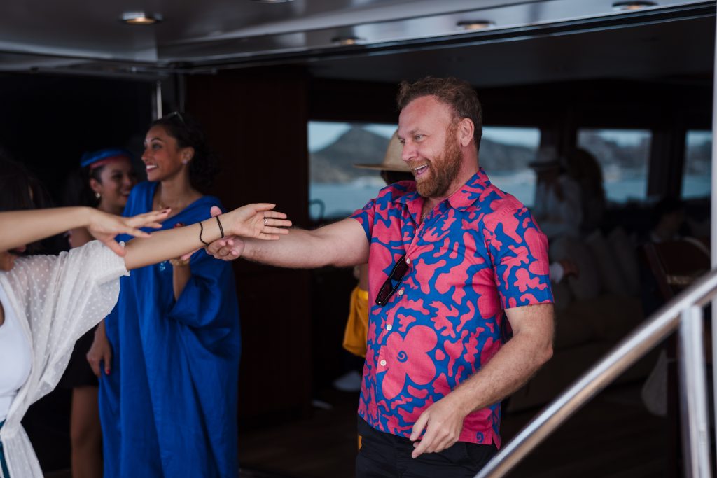 Burak Cakmak dancing during Ocean Blue world yacht experience