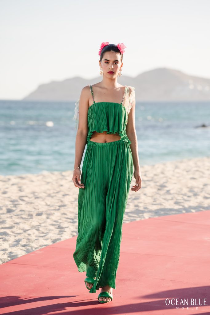 Model on runway wearing greeen Waad Aloqaili Couture 