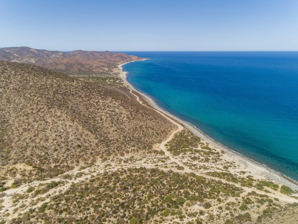 photo of East Cape hillside and ocean