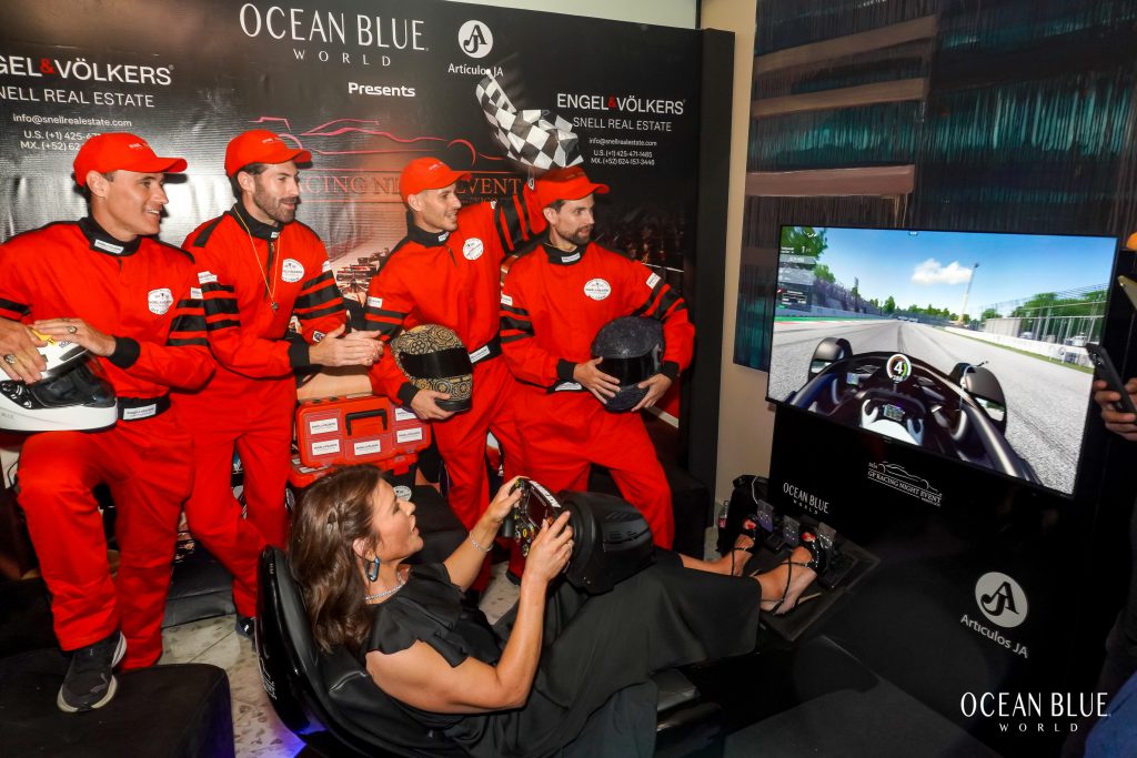 phot of vanessa fukunaga trying out the ENGEL & VÖLKERS LOS CABOS F1 COCKPIT SIMULATOR