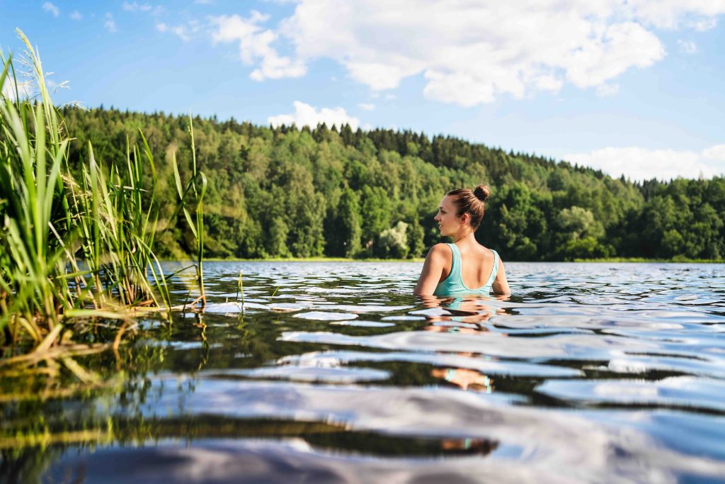 Swimming in lake in Finland.