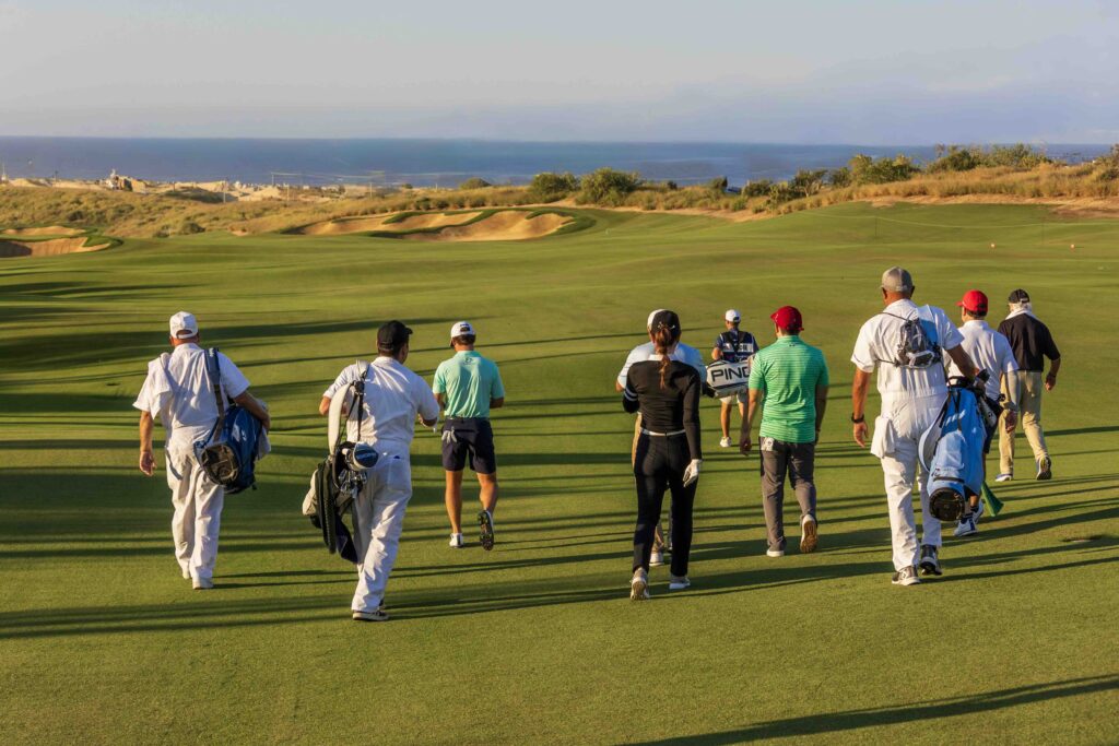 Players and caddies make their way across El Cardonal at Diamante — a course defined by its meticulous design, dramatic bluffs, and Pacific panoramas. 